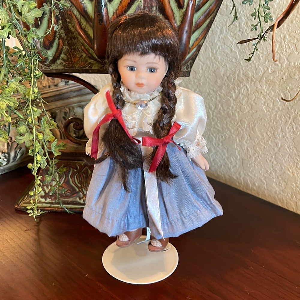 Collectible doll on stand